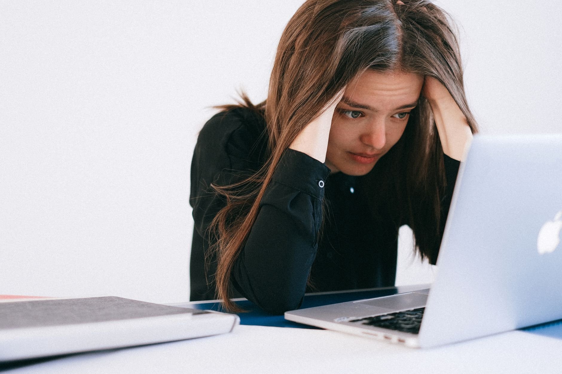 Stressed professional at laptop