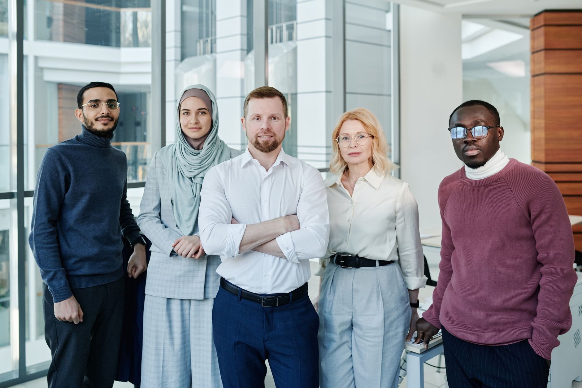 Diverse group of confident professionals in modern office