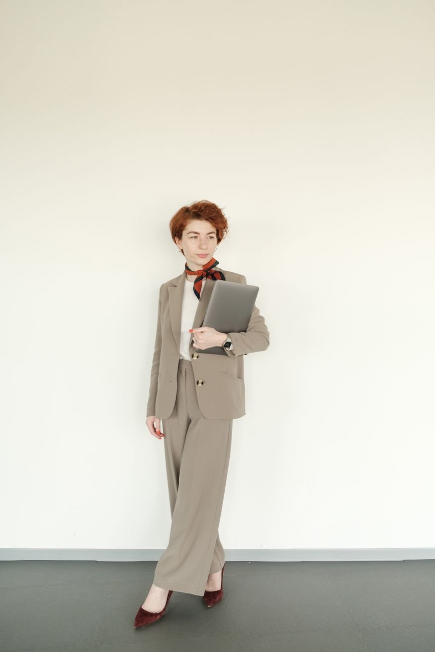 Confident professional woman with laptop