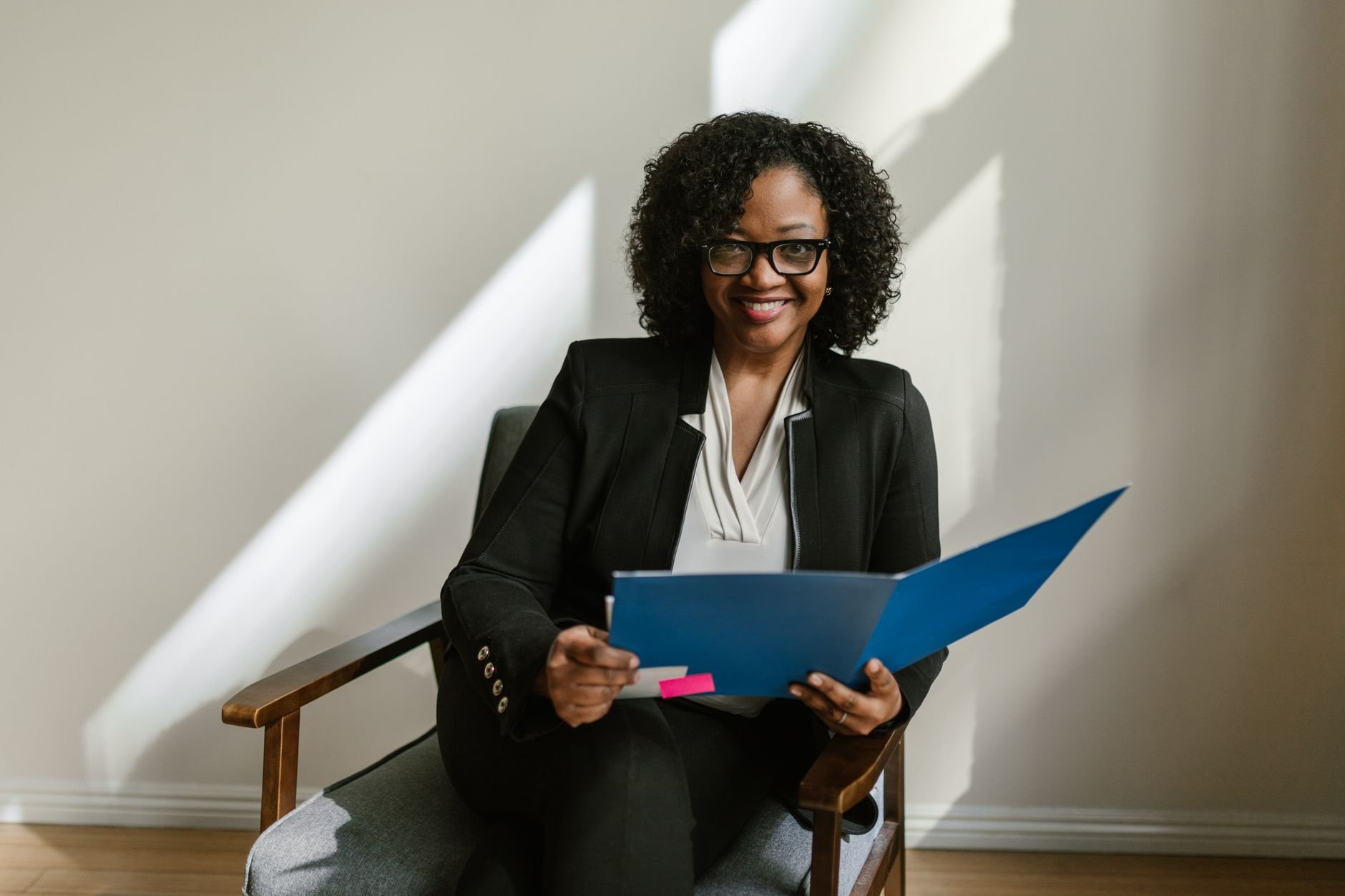 Professional woman ready for interview holding folder